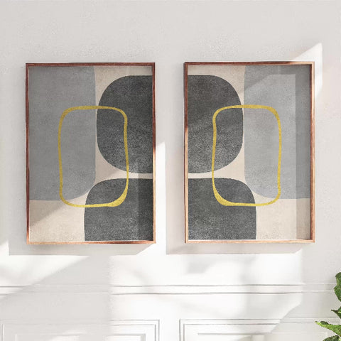 Set of two modern abstract wall art prints with grey and black shapes outlined in yellow, minimalist geometric design in wooden frames – Adam & Alice